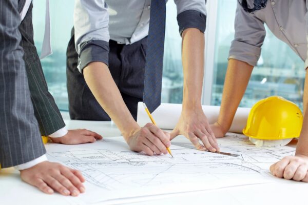 people checking building plans
